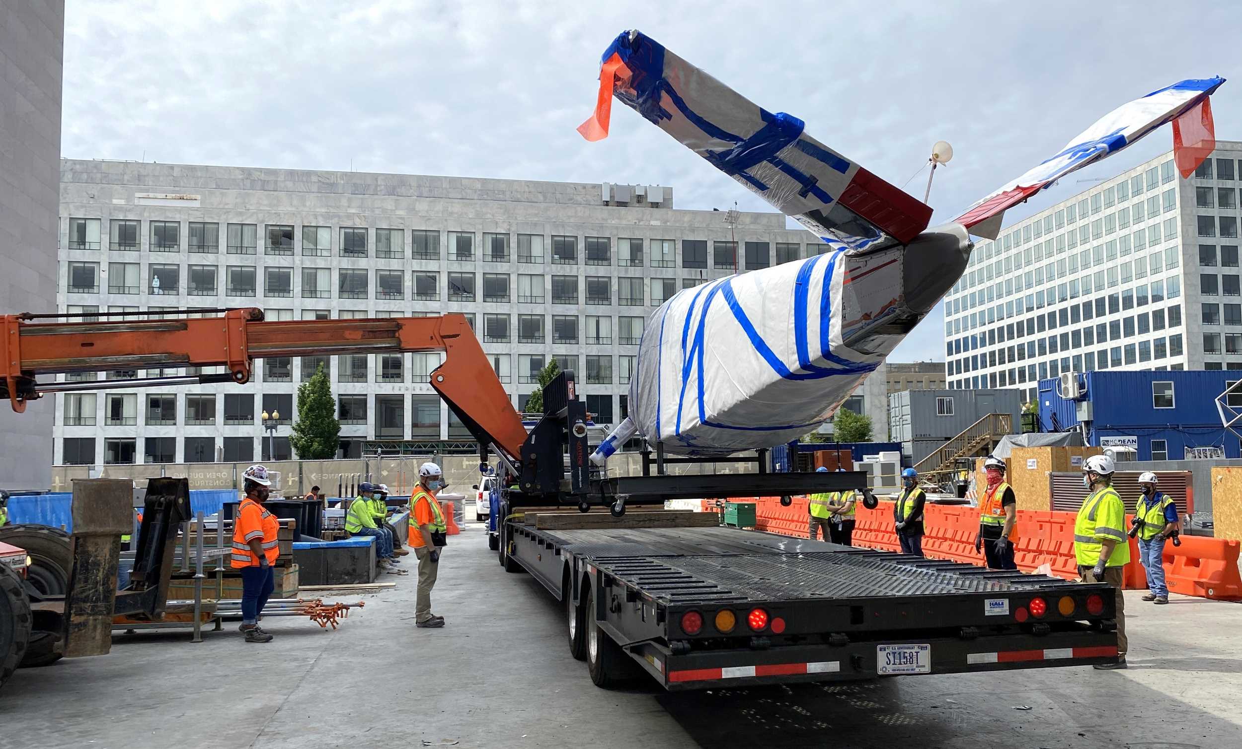 An artifact arriving on a truck and being unloaded with a telehandler. Most large artifacts, such as aircraft, arrive this way. My role was to coordinate delivery dates and times and assure necessary permits for wide loads and road closures had been obtained.